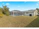 Large backyard with a screened pool at 3341 Rock Creek Dr, Port Charlotte, FL 33948