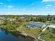 Aerial view of waterfront home with pool and private dock at 3341 Rock Creek Dr, Port Charlotte, FL 33948