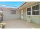Covered patio with a side entrance to the home at 3341 Rock Creek Dr, Port Charlotte, FL 33948