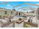 Relaxing pool area with lounge chairs and a dining table at 3341 Rock Creek Dr, Port Charlotte, FL 33948