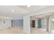 Open concept living area with view to kitchen and pool at 3341 Rock Creek Dr, Port Charlotte, FL 33948
