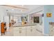 Kitchen with an island, and views into the living room at 3341 Rock Creek Dr, Port Charlotte, FL 33948