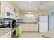 Galley style kitchen with stainless steel appliances at 3341 Rock Creek Dr, Port Charlotte, FL 33948