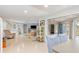 Bright living room with tile floors, comfy seating and access to other rooms at 3341 Rock Creek Dr, Port Charlotte, FL 33948