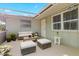 Covered patio furnished with seating and a coffee table at 3341 Rock Creek Dr, Port Charlotte, FL 33948