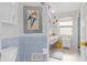 Clean bathroom with a single sink vanity, shower, and toilet at 3341 Rock Creek Dr, Port Charlotte, FL 33948