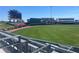 View of a baseball stadium with green field and seating at 3341 Rock Creek Dr, Port Charlotte, FL 33948
