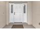 White front door with sidelights and a welcoming entryway at 176 Jennifer Dr, Rotonda West, FL 33947