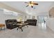 Spacious living room with leather furniture and tile floors at 176 Jennifer Dr, Rotonda West, FL 33947