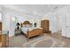 Bedroom with wood furniture and tile flooring at 176 Jennifer Dr, Rotonda West, FL 33947