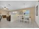 Bright dining room with white table and chairs at 176 Jennifer Dr, Rotonda West, FL 33947