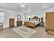 Spacious bedroom with wood furniture and tile flooring at 176 Jennifer Dr, Rotonda West, FL 33947