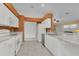 White kitchen with stainless steel appliances and tile floor at 176 Jennifer Dr, Rotonda West, FL 33947