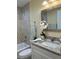 Elegant bathroom with tub-shower combo, granite countertop vanity and decorative mirror at 22235 Albany Ave, Port Charlotte, FL 33952