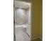 Well lit bathroom featuring stylish tile work in the shower-tub area, and vanity with granite countertop at 22235 Albany Ave, Port Charlotte, FL 33952