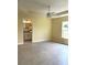 Bedroom with a large window and access to an ensuite bathroom, providing comfort and privacy at 22235 Albany Ave, Port Charlotte, FL 33952