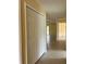 Hallway featuring tile floors, closet, neutral walls, and easy access to the rest of the home at 22235 Albany Ave, Port Charlotte, FL 33952