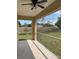 Relaxing enclosed patio offering fresh air through screen windows and tiled floors for comfort at 22235 Albany Ave, Port Charlotte, FL 33952