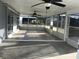 Large enclosed patio with dual ceiling fans and screened windows at 4127 Gardner Dr, Port Charlotte, FL 33952