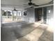 Spacious enclosed patio with dual ceiling fans and access to kitchen at 4127 Gardner Dr, Port Charlotte, FL 33952