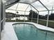 Screened pool with canal view and a spacious enclosure at 4127 Gardner Dr, Port Charlotte, FL 33952