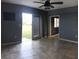 Living room with tile floors, french doors, and ceiling fan at 4127 Gardner Dr, Port Charlotte, FL 33952
