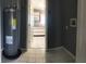 Laundry room with water heater and access to kitchen at 4127 Gardner Dr, Port Charlotte, FL 33952