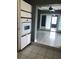 Kitchen with built-in oven and view of dining area at 4127 Gardner Dr, Port Charlotte, FL 33952