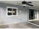Covered patio with ceiling fan, adjacent to kitchen and interior at 4127 Gardner Dr, Port Charlotte, FL 33952
