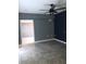 Bedroom with tile floors, ceiling fan and access to another room at 4127 Gardner Dr, Port Charlotte, FL 33952