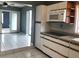 Bright kitchen features white cabinets, tile floors, and a microwave at 4127 Gardner Dr, Port Charlotte, FL 33952