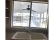 Kitchen sink with view of canal-front pool and patio at 4127 Gardner Dr, Port Charlotte, FL 33952