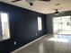 Living room with dark walls, tile floor and windows at 4127 Gardner Dr, Port Charlotte, FL 33952