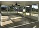 Bright, enclosed patio with ceiling fans and screened windows at 4127 Gardner Dr, Port Charlotte, FL 33952