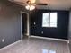 Bedroom with tile floors, ceiling fan and window at 4127 Gardner Dr, Port Charlotte, FL 33952