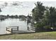 Private dock with peaceful canal views and lush landscaping at 4127 Gardner Dr, Port Charlotte, FL 33952