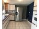 Kitchen with stainless steel refrigerator and ample counter space at 4127 Gardner Dr, Port Charlotte, FL 33952