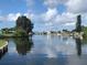 Tranquil waterfront view with lush trees and calm water at 4127 Gardner Dr, Port Charlotte, FL 33952