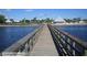 Long fishing pier extending over the water with views of the park at 4127 Gardner Dr, Port Charlotte, FL 33952