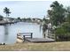 Private dock on tranquil canal, offering scenic waterfront views at 4127 Gardner Dr, Port Charlotte, FL 33952