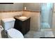 Bathroom with toilet, sink, and shower stall at 4127 Gardner Dr, Port Charlotte, FL 33952