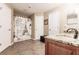 Bathroom featuring a granite countertop, shower, and tiled floors at 4238 Golfair Ln, North Port, FL 34288