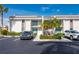 Two-story condo building with parking and landscaping at 1439 Mediterranean Dr # C, Punta Gorda, FL 33950
