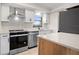 Modern kitchen with white cabinets and quartz countertops at 1439 Mediterranean Dr # C, Punta Gorda, FL 33950