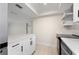 Modern kitchen with white cabinets and quartz countertops at 1439 Mediterranean Dr # C, Punta Gorda, FL 33950