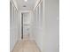 Hallway with built-in storage and tile floors at 1439 Mediterranean Dr # C, Punta Gorda, FL 33950