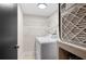 Well-equipped laundry room, featuring washer, dryer, and ample shelving at 1439 Mediterranean Dr # C, Punta Gorda, FL 33950