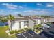 Condo building with parking and palm trees at 1439 Mediterranean Dr # C, Punta Gorda, FL 33950