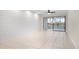 Bright living room with water views and shiplap wall at 1439 Mediterranean Dr # C, Punta Gorda, FL 33950