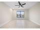 Bright bedroom with water views and ceiling fan at 1439 Mediterranean Dr # C, Punta Gorda, FL 33950